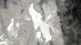 ECOSTRESS Tiled Top of Atmosphere Calibrated Radiance version 2 bands 5-4-2 data mosaic comprised of six tiles (12TTL, 12TTM, 12TUL, 12TUM, 12TVL, 12TVM) from the ECO_L1CT_RAD product over the Great Salt Lake in Utah, USA on March 18, 2023.