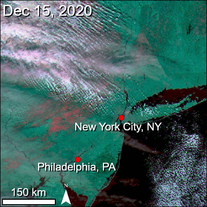 Gif showing a snow storm over the eastern seaboard in a snow and ice mapping band combination that highlights snow and ice as shades of pink.